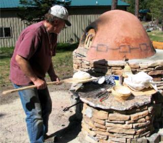 Dee with his pizza and bread oven